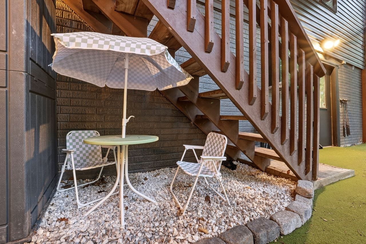 Under-deck lounge table and cornhole